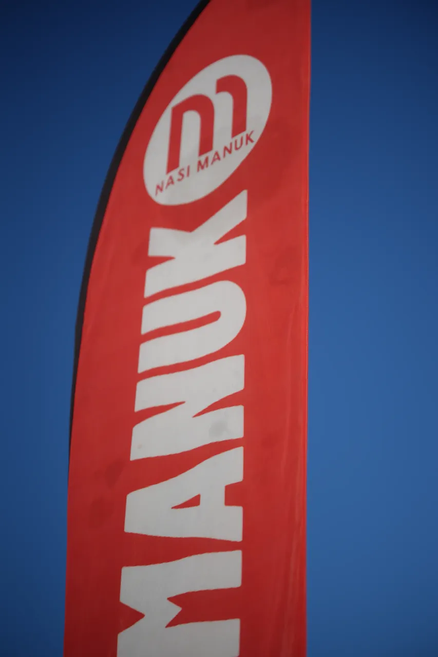 Nasi Manuk banner against clear sky