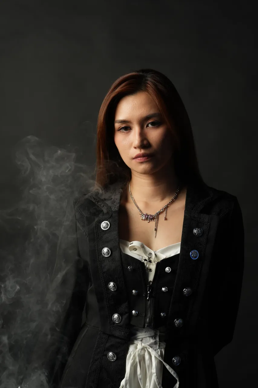 Atmospheric haze drifting across a front-facing portrait