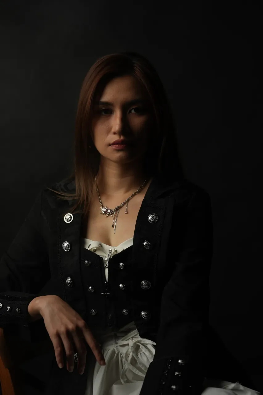 Seated three-quarter portrait, single soft key from camera left