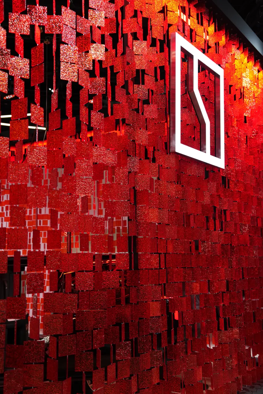 Illuminated red LED feature wall on the exhibition floor