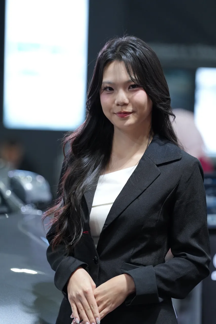 Corporate-style portrait of a stand host on the floor