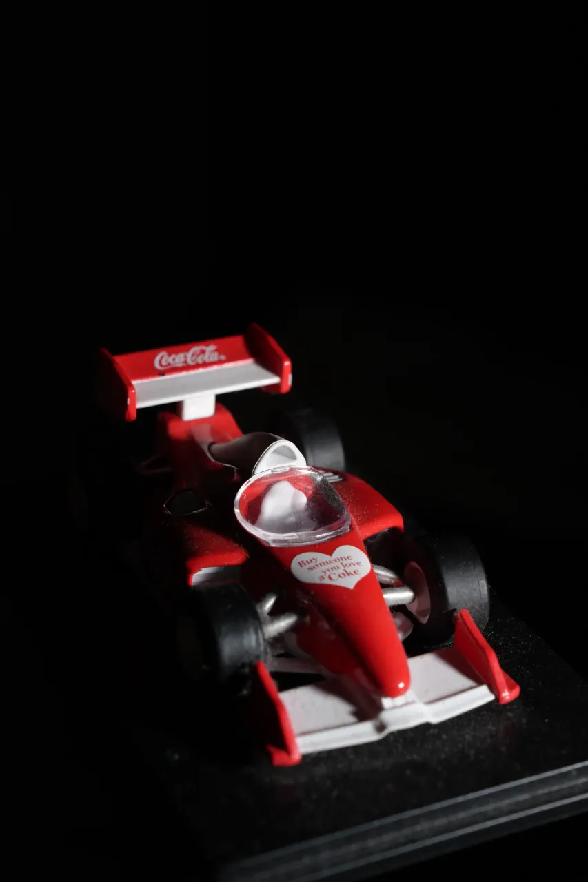Coca-Cola F1 collectible — bold e-commerce product photography